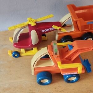 Vintage Buddy L helicopter and trucks
